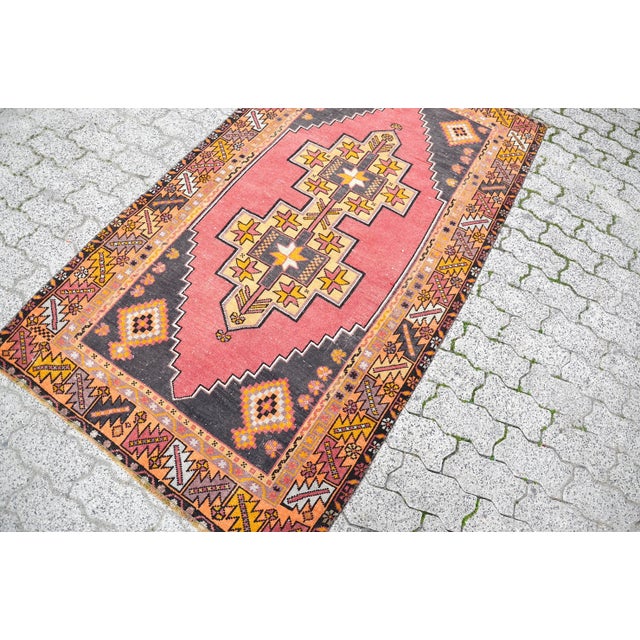 This is a vintage Turkish Oushak rug from the 1960s. The piece was hand-knotted.