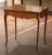 Combining fine craftsmanship with practical versatility, this antique French Louis XV style game table features intricate...