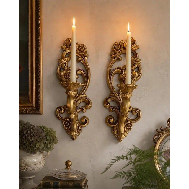 Striking vintage 1971 Homco #4138 wall appliqués, offered as a matching pair. These ornate gold-tone pieces feature an...