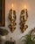 Striking vintage 1971 Homco #4138 wall appliqués, offered as a matching pair. These ornate gold-tone pieces feature an...