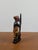 Masterfully hand-carved in Ghana, this striking one-of-a-kind sculpture captures an African woman engaged in the...