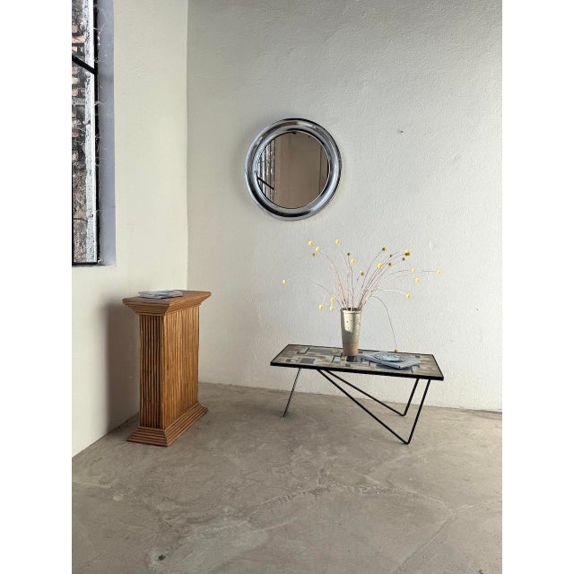 Vintage 1950s metal coffee table with a ceramic top. we love the unique base with its graphic shapes. The contrast between...