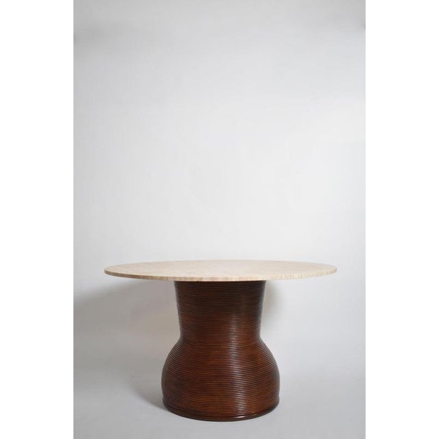 Rattan and travertine round dining table, 1970s. Height: 76 cm - 29.92 in Diameter: 130 cm - 51.18 in