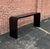 USA, 1970s Long and taller than most- waterfall console table in durable black laminate. Hearty construction. A very...