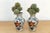 This pair of miniature jars is a fine example of traditional East Asian ceramic techniques, featuring a classic crackle-...