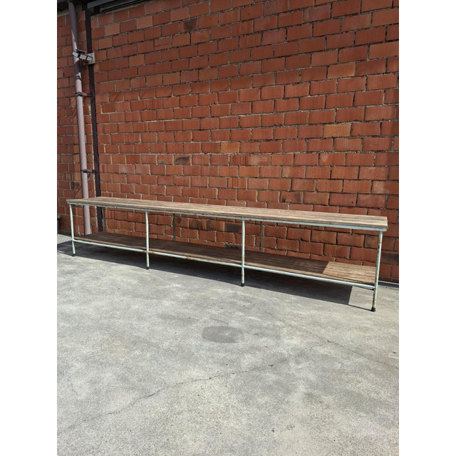 Original industrial workbench with a soft green metal frame and wooden top. Almost four metres long, making it ideal as a...