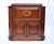 Midcentury bar cabinet of radiant grain solid Rosewood with intricate brass inlay details throughout. Substantial mirrored...