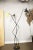 This triennial floor lamp in the style of Stilnovo is made of iron and brass. Up to 250V (Europe/UK Standard).The wiring...