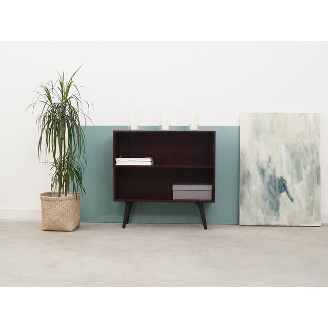 The bookcase was made in the 1970s, produced by the well-known Danish manufactory Hjørnebo. The structure is covered with...