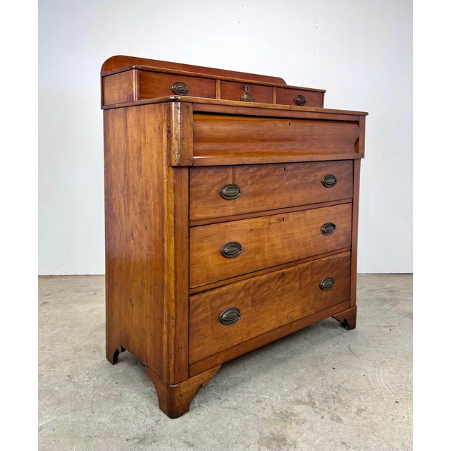 This antique Early American Victorian style chest of drawers, crafted from solid yellow pine, features a distinctive step-...