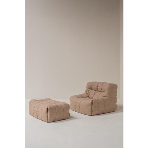 Iconic Kashima lounge chair with matching pouf designed by Michel Ducaroy for Ligne Roset in the 1970s. This sculptural...