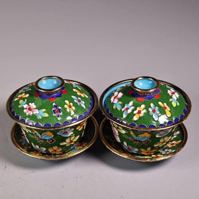 This charming pair of vintage cloisonne enamel tea bowls, or gaiwan, comes complete with matching lids and saucers. Each...