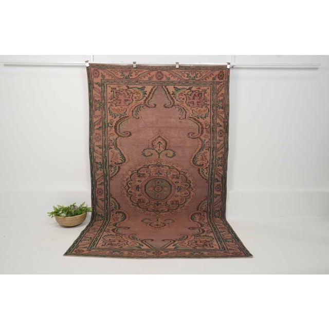 Vintage Hand-Knotted runner rug is a semi-antique vintage area rug. The '70s Eastern region of Anatolia's unique rug is...