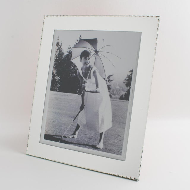This stunning French mirrored glass picture frame has exquisite silver mirror-beveled edges with a deep geometric design....