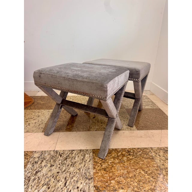 Stylish pair of early 2000s X-base benches upholstered in gray faux crocodile textured fabric. Each bench has a tailored...