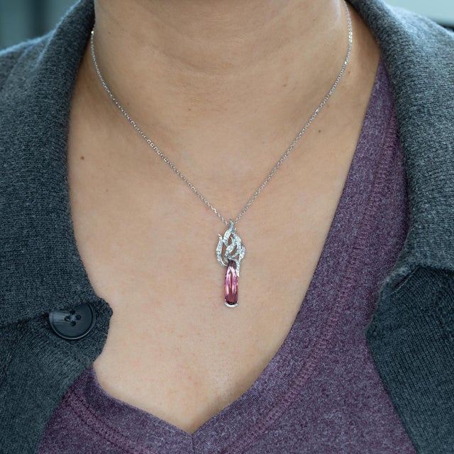 This stunning 3.2Ct pink tourmaline estate pendant is beautifully accented with earth-mined diamonds, set in solid 18K...