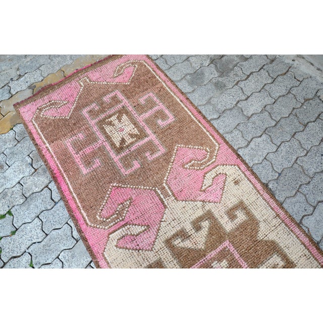 This is a vintage Turkish Oushak rug from the 1960s. The piece was hand-knotted.