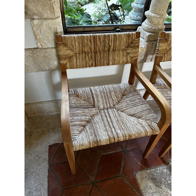 A softly curved teak chair accented with expertly hand-woven natural seagrass, this classically elegant chair is minimally...