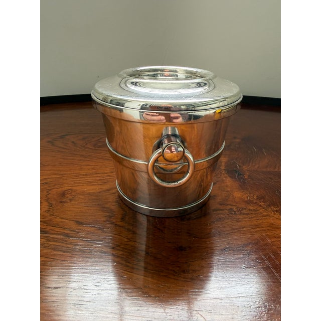 For your caviar or maybe to just hold a fewpens, a stylish piece of antique Gorham silver plate of champagne bucket form....