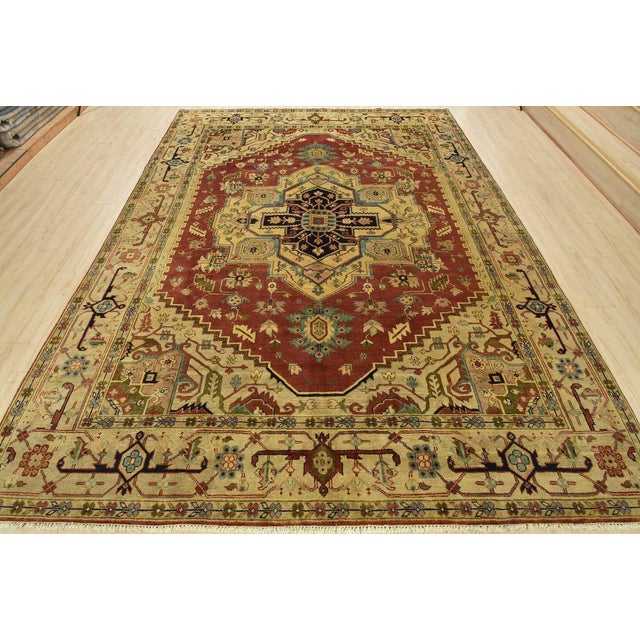 This traditional tribal Serapi rug is hand-knotted with an all-wool pile on a cotton foundation. This rug is new and in...