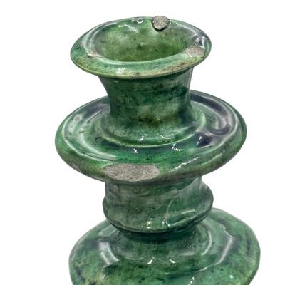 A Moroccan Tamegroute glazed candlestick holder is a handcrafted piece made in the historic pottery village of Tamegroute...