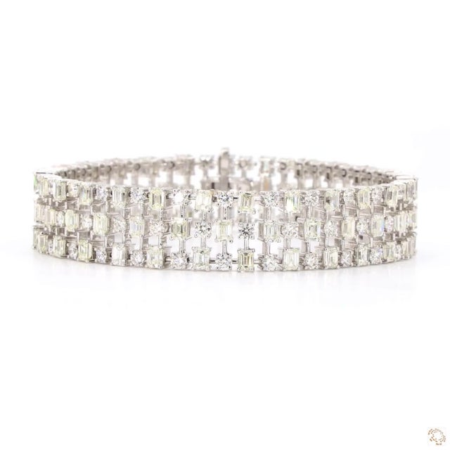 This line bracelet from our contemporary estate collection centers on an 11.95-carat diamond in a step-cut emerald shape....
