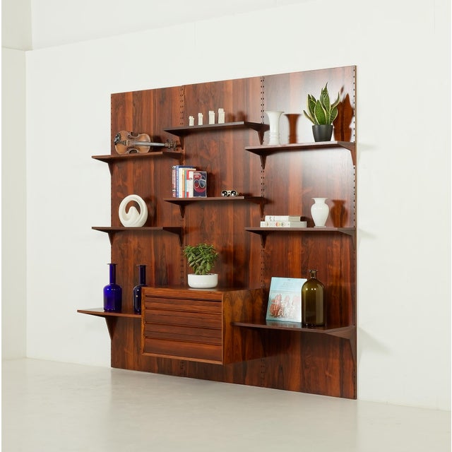 The rosewood wall unit on panels was designed by poul cadovius and made by cado in the 1960s. the simplicity is paired...