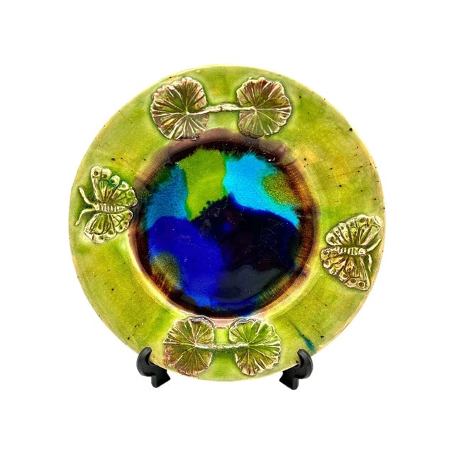 Add a unique touch to your home decor with this gorgeous handmade ceramic plate. The plate features stunning butterflies...