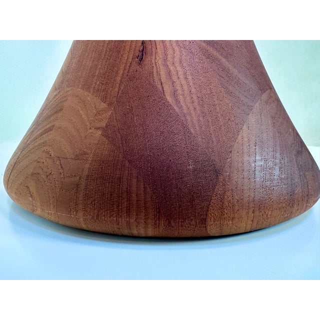 This high-quality floor lamp was manufactured in germany during the 1970s. It features a sculptural stem and base from...