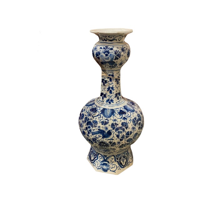 Circa 1700 large Delft Knobble vase with marked underglaze. Hand painted blue and white florals with a bird.