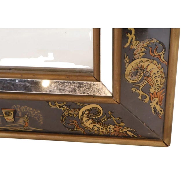 A black eglomise mirror with Asian designs. This exquisite eglomisé mirror features a striking chinoiserie design, where...