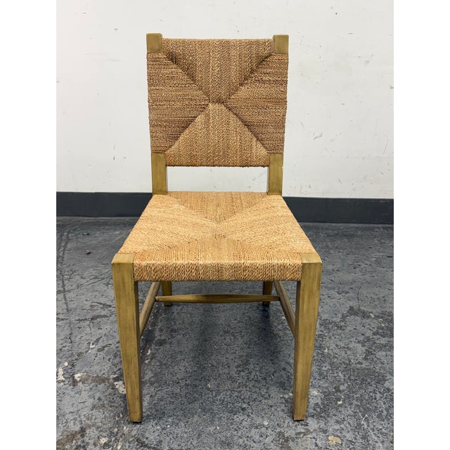 Design Plus Gallery presents the Rutherford Woven Side Chair from Williams Sonoma Home. This side chair pairs a light oak...
