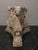 Large and substantial cast stone architectural capital featuring sculptural ram head motifs, curled horns, floral details,...