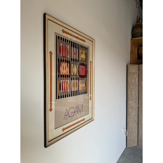 An exceptionally and original "OP ART" hand signed poster by Israeli artist YAACOV AGAM. It is hand signed on the bottom...