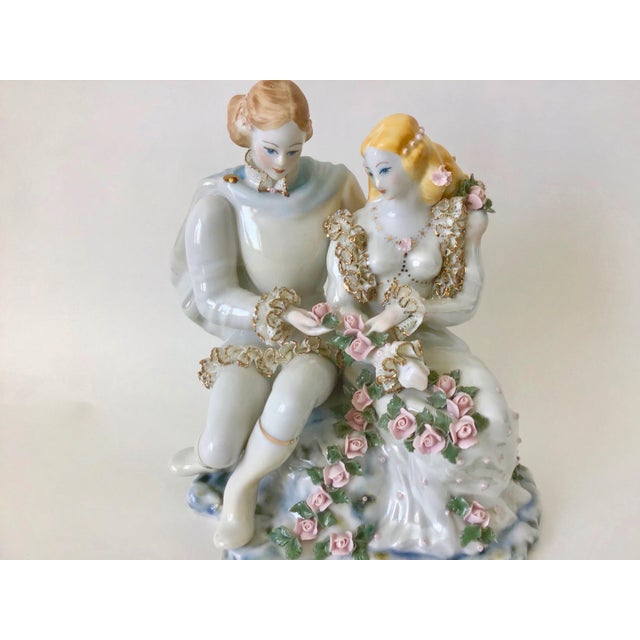 Victorian vintage porcelain figurine. Gorgeous flower and gold accents details.