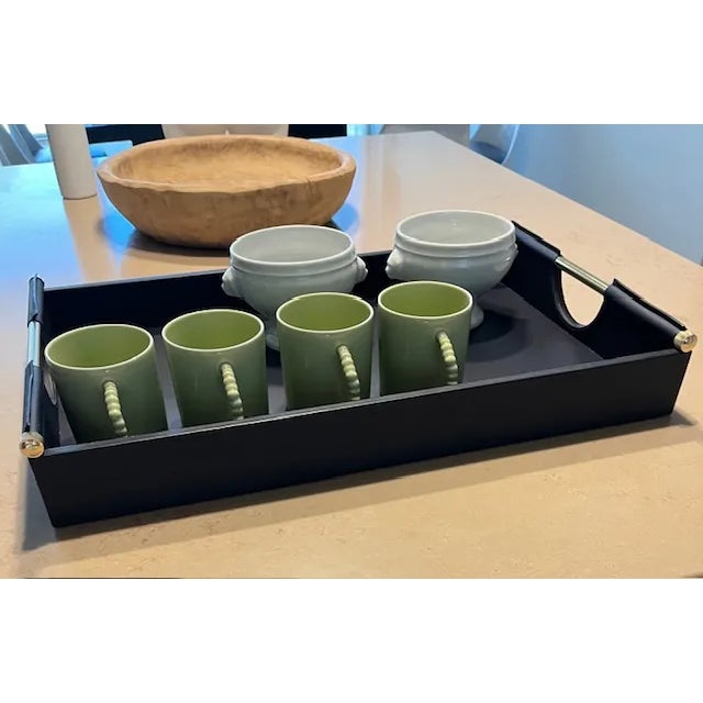 A brand-new Ralph Lauren leather tray, 22" x 14" x 4", smooth calf leather in navy with polished brass handles — luxurious...