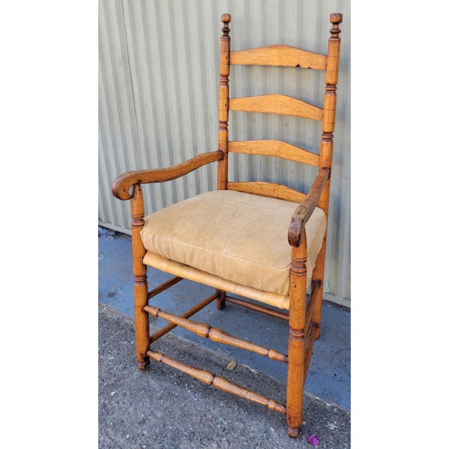 18Thc Pine ladder back chair from New England in fine sturdy condition.The seat cushion is in leather with a leather...