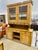 The piece is a vintage or antique wooden hutch, crafted from pine 1. Front View: • The top section features a pair of...