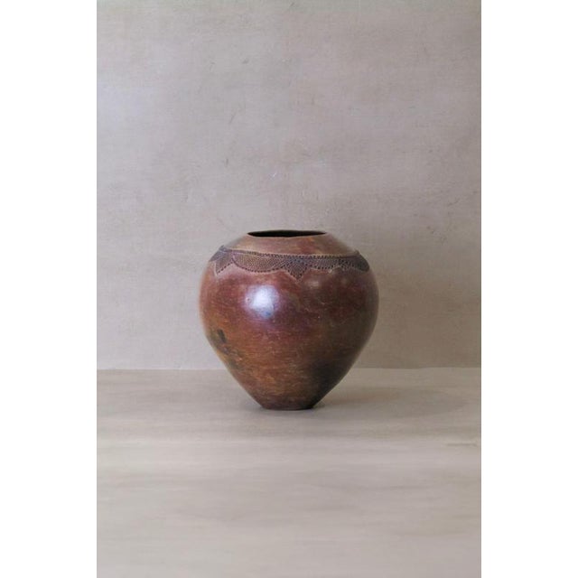 The Zulu pot, originating from South Africa, holds a distinguished role in the traditional practices of the Zulu people,...