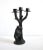A candelabrum (aka candelabra) featuring a black bear standing up against a tree with three branches for candles; resin...