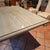 6ft vintage Italian travertine dining table on matching travertine pedestal. It has a protective glass cover, which can be...