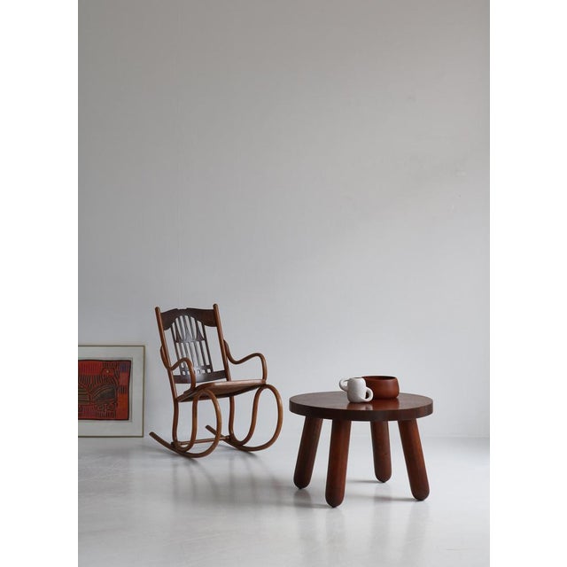 Early and important circular coffee table made of oak with solid club shaped legs. These tables were made in small numbers...