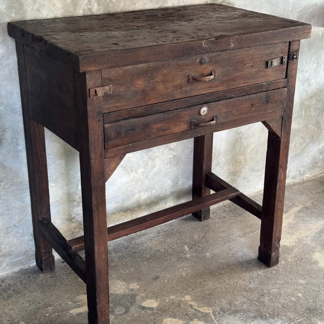 Antique Indonesian teak workbench with two drawers and a stretcher. Dimensions: Total height 89.5 cm; Depth: 49 cm; Width:...