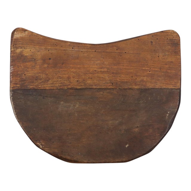 Rustic wooden three-legged stool with a D-shaped seat—a Wabi-sabi style milking stool—an authentic piece from the first...