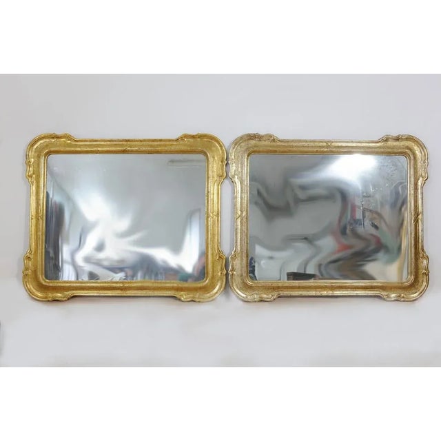 Pair of golden mirrors, lobed corners, not perfectly the same as patina, (see details in photography). It is possible to...