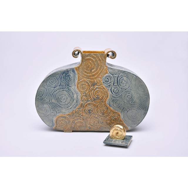 Volume: 2 Liters, Weight: 2kg This ceramic urn is a unique piece handcrafted with care and passion. It´s lid shows a...