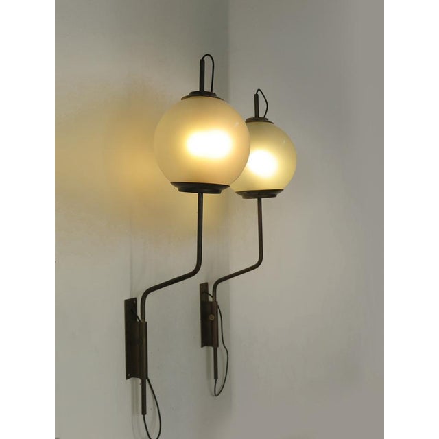Set of two Midcentury modern design sconces eall lights, model LP11, designed by Luigi Caccia Dominioni and produced by...