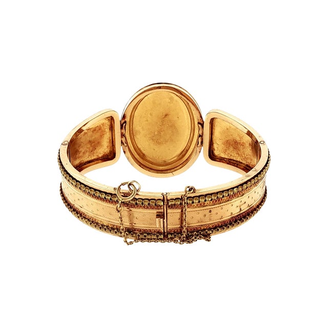 An exquisite mid-19th-century hand-fabricated and engraved hinged bracelet. Crafted from 18k gold and platinum (rare for...