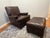 A striking two-piece vintage dark brown leather push-back reclining lounge chair and matching ottoman set by the Kittinger...