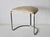 Vintage Bauhaus-style tan seat chrome tubular cantilevered stool. Tubular chrome and off-white upholstered, lightly padded...